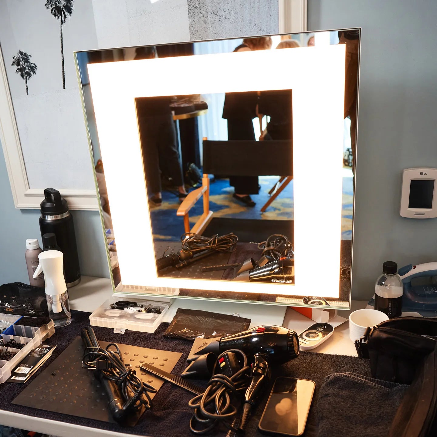 White Meira Home LUXe on a table setup for red carpet hair styling
