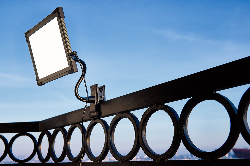 Key Light LED light panel on an EZ Clamp on a balcony