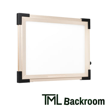 TML Key Light Gold on white with "TML Backroom" written