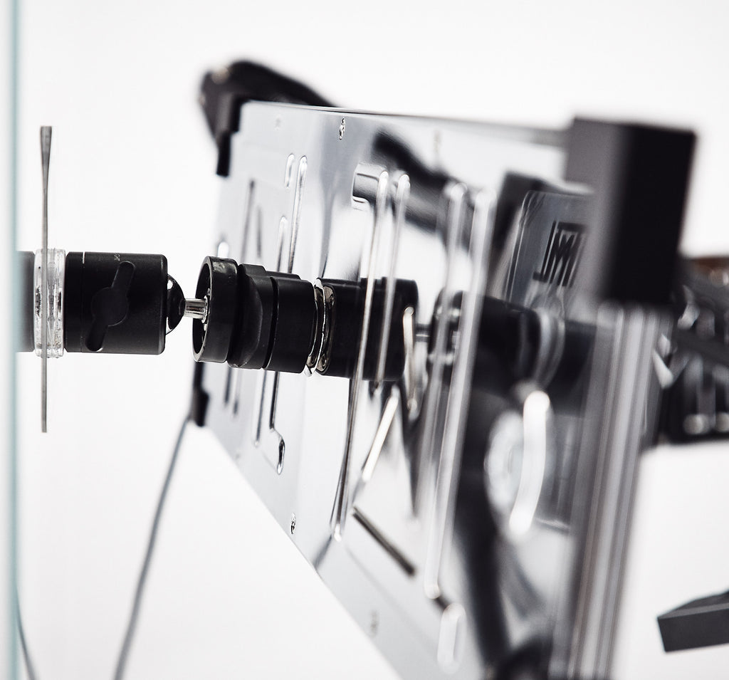 Close up of an Eyelight on a Magic Mount mounted to a surface